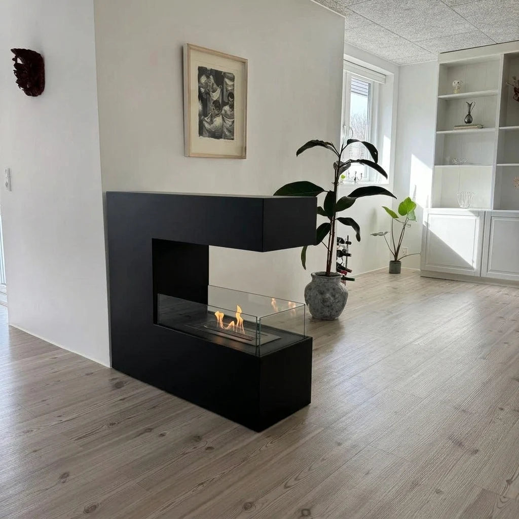 Topeka Black 3-sided bio fireplace in a bright living room, lit flame
